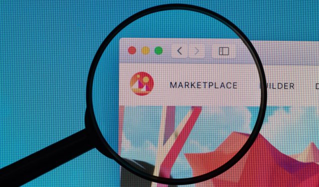 decentraland marketplace logo under magnifying glass cc by 20